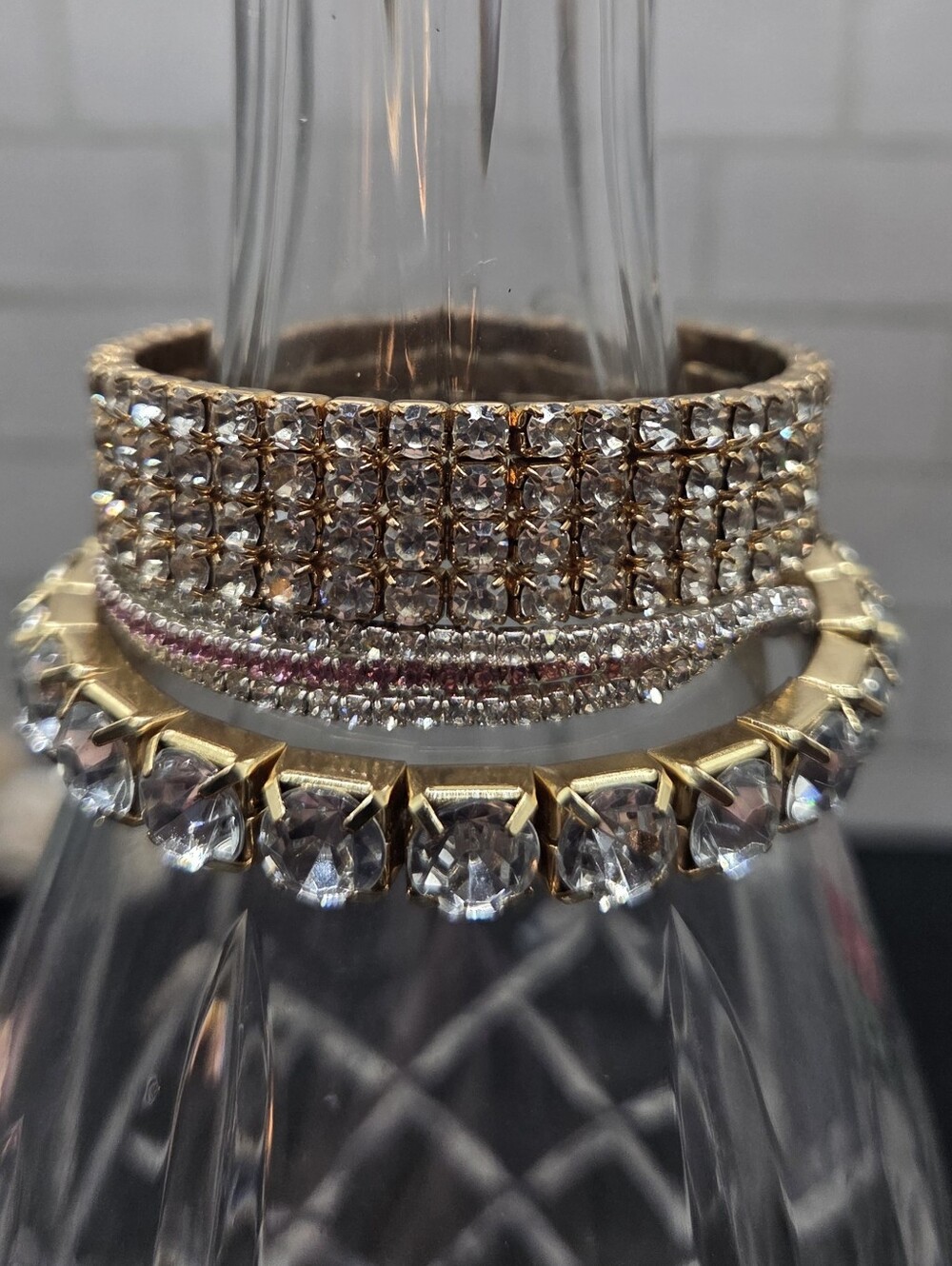 1406. Five Crystal-Accented Gold And Silver Tone Stretch Bracelets